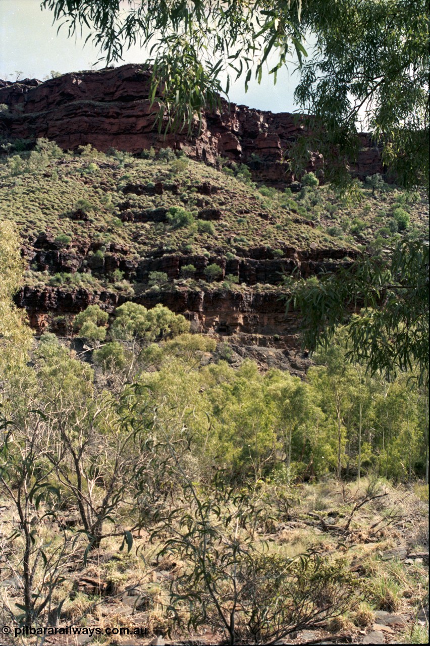196-34
Wittenoom Gorge, Gorge Mine area, view of mine adits or entry points of drives going into the side of the gorge western side of Wittenoom Gorge.
