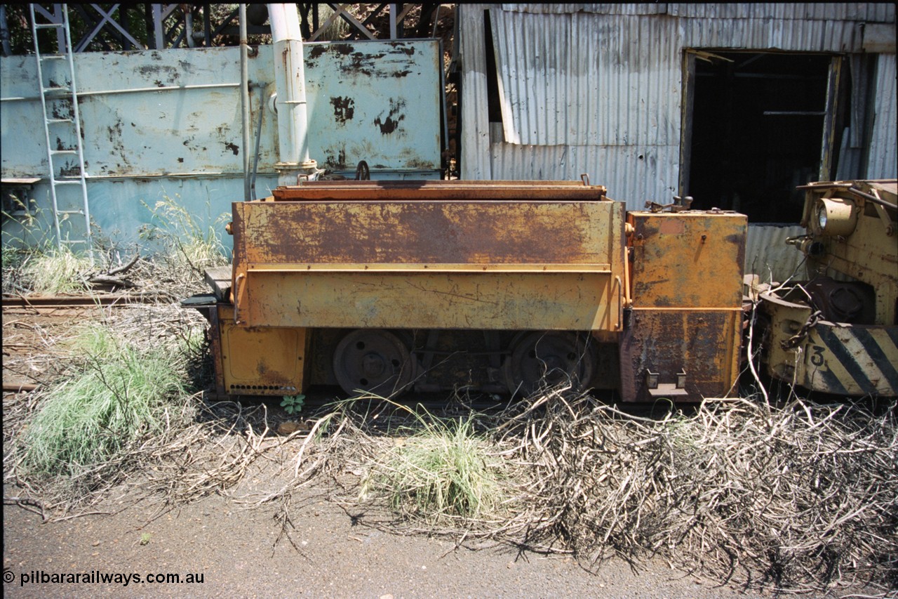 197-36
Wittenoom, Colonial Mine, asbestos mining remains, side view of throttle control box, battery box and wheel and brake arrangement of battery locomotive GEMCO Hauler serial 12304-05/10/65, motor H.P. 2/11, volts 80, drawbar pull (lbs.) 1250 built by George Moss Pty Ltd Leederville, WA.
Keywords: Gemco;George-Moss;12304-05/10/65;