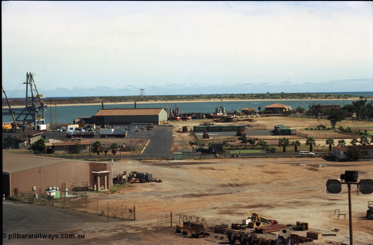198-27
Port Hedland Port, view across hard stand area, shows tug pen and BHP Transport admin building, locals will also notice Customs House, new bulk loader under construction.
