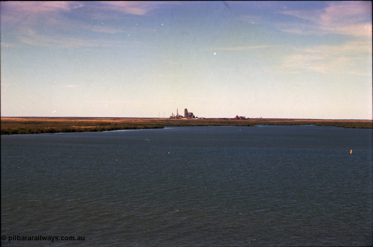 198-31
Port Hedland Port, view across harbour with now demolished HBI plant in the background, this plant was flattened in October 2011, this view is 2001, FMG have now built berths in this area and Roy Hill have a couple on the right.
