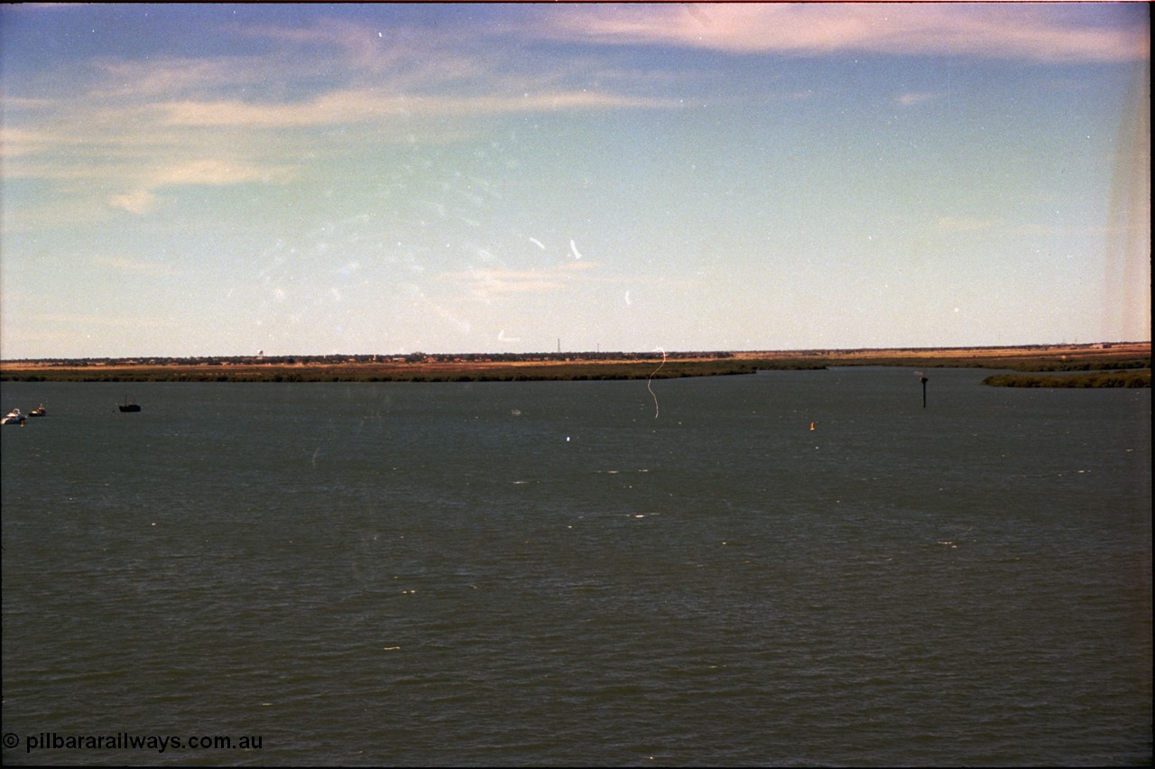 198-33
Port Hedland Port, view of ship turning basin with the South Hedland water tank in the distance, FMG now have a three berths in this location on the right. Early 2001.
