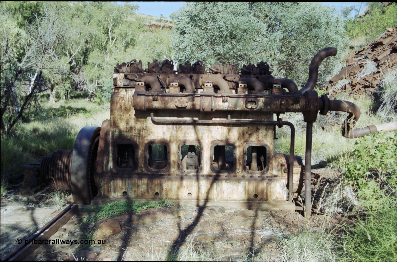 203-32
Yampire Gorge, remains of asbestos mining, 5 cylinder diesel motor with drive pulley and fly wheel, possibly an air compressor.
