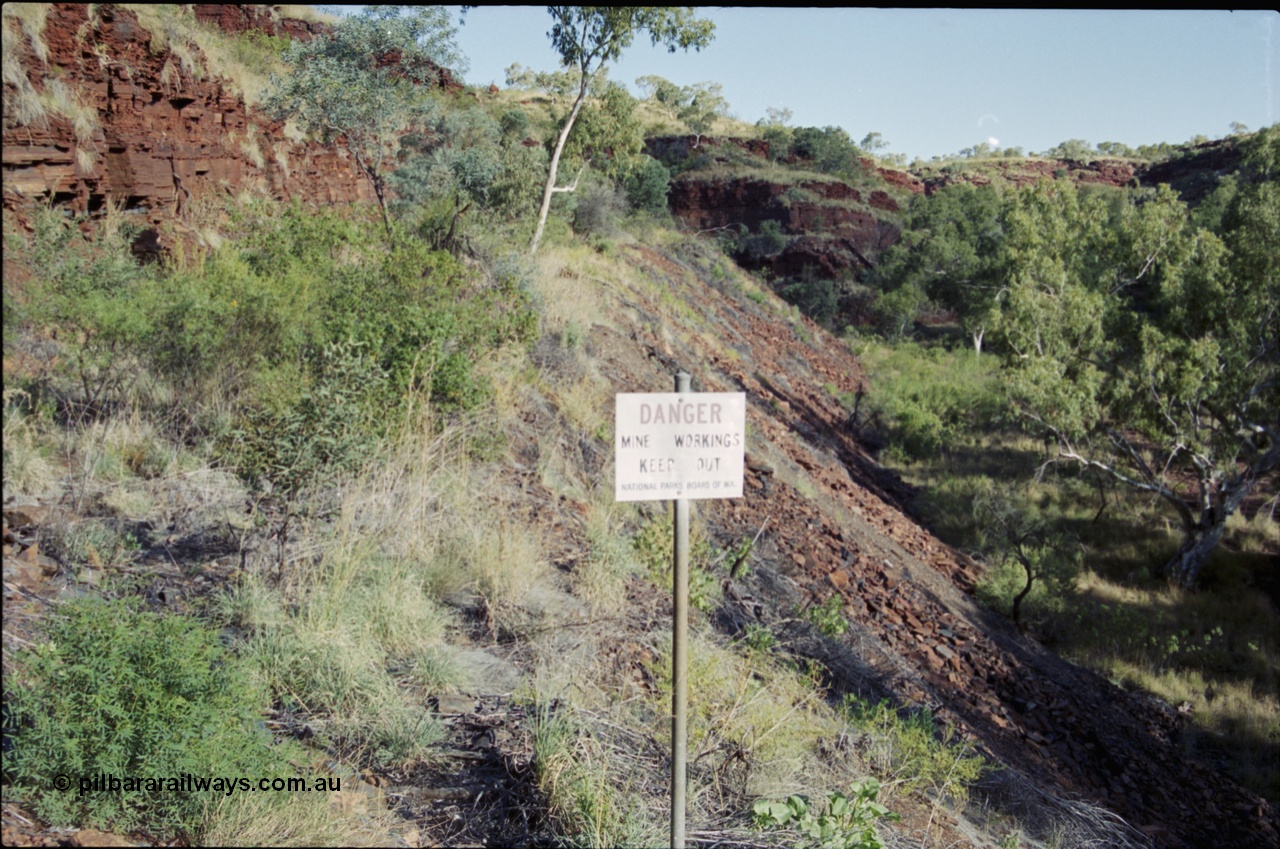 203-35
Yampire Gorge, remains of asbestos mining, former roadway over grown with sign from the National Parks Board of WA.

