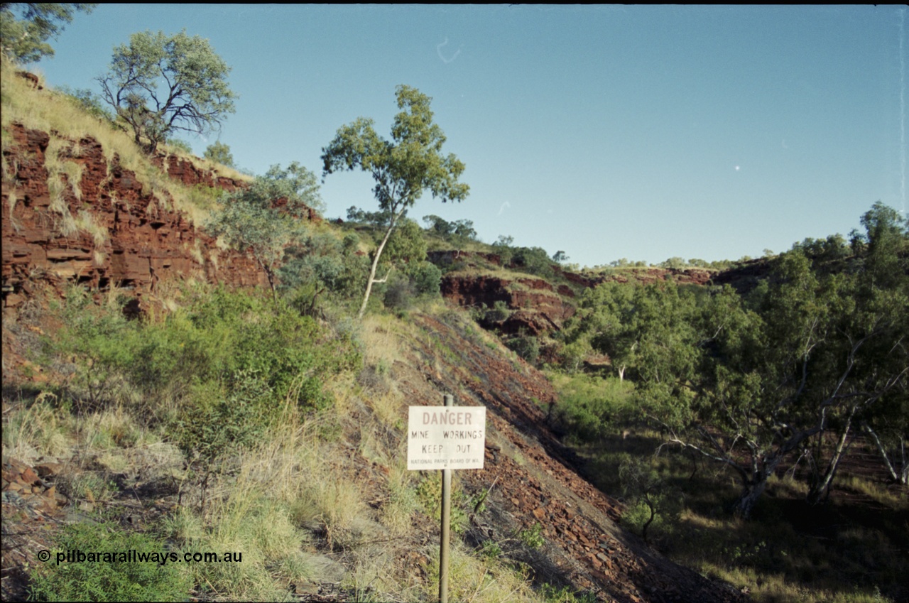 203-36
Yampire Gorge, remains of asbestos mining, former roadway over grown with sign from the National Parks Board of WA.
