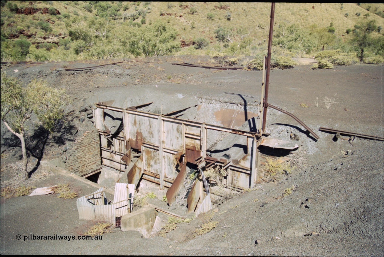 204-25
Wittenoom Gorge Mine, remains of asbestos mining, view of the unloading area with the hoppers and chutes where the underground tipping ore cars were emptied.
