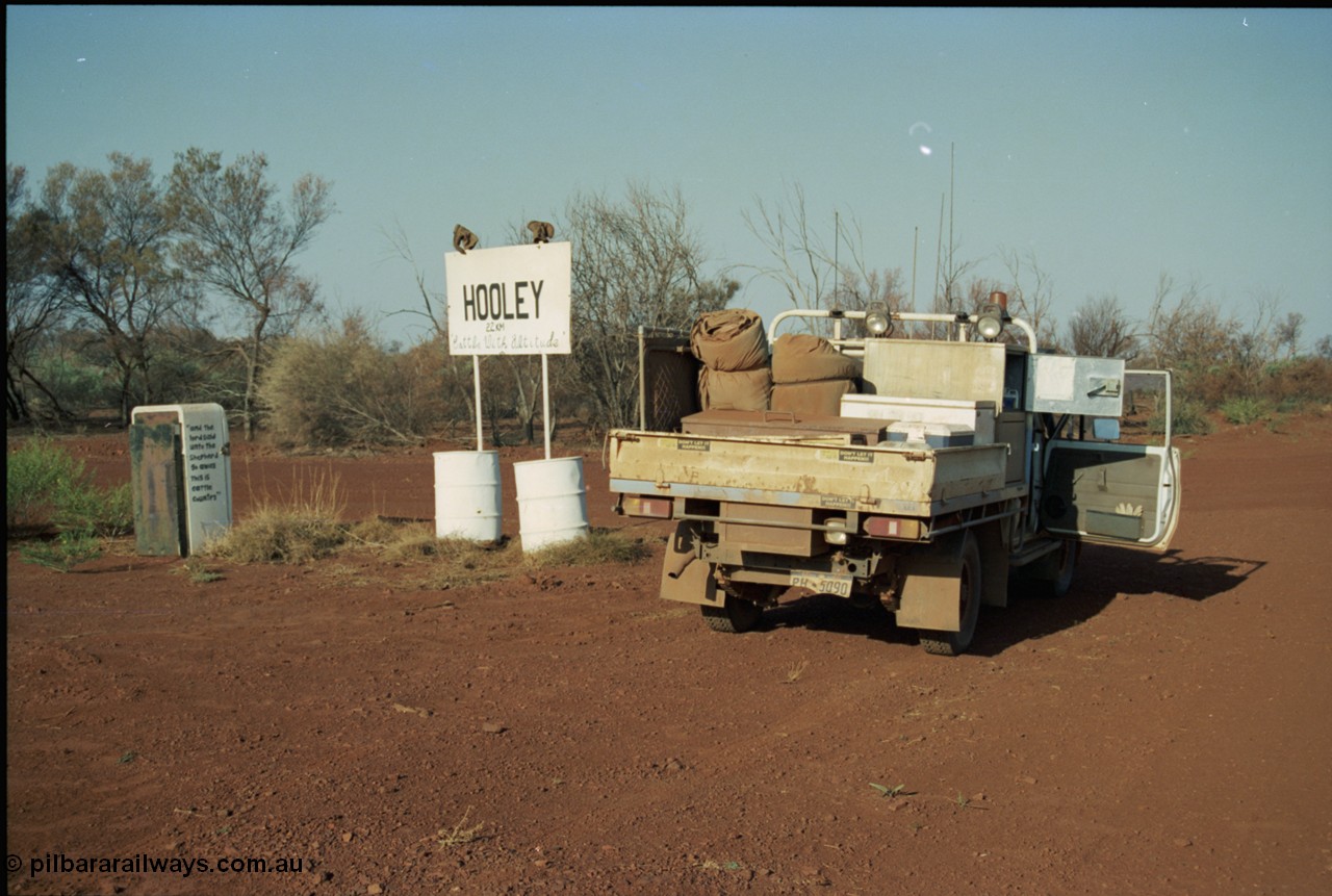 205-06
Hooley Station front gate, old refrigerator used for mailbox, 'and the lord said unto the Shepard go away this is cattle country', sign - , 'Cattle With Altitude'.
