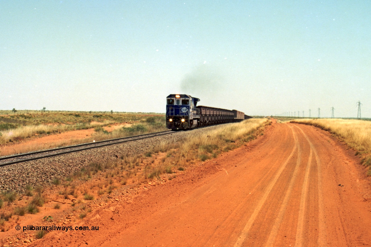 206-26
An empty train on the Yarrie (former Goldsworthy) line behind BHP 5633 'Hephaestus' built new in 1988 by Goninan as a GE CM39-8 model, serial 5831-12 / 88-082. The four CM39-8 units were upgraded to CM40-8 units following overhauls and finally scrapped in January 2016.
Keywords: 5633;Goninan;GE;CM39-8;5831-12/88-082;