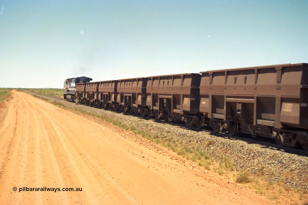 206-31
An empty train on the Yarrie (former Goldsworthy) line behind BHP 5633 'Hephaestus' with a string of Golynx ore waggons, built by Goninan WA to a Lynx Engineering design, these are belly dump waggons as opposed to the BHP fleet of rotary dump bodies.
Keywords: 8419;Goninan-WA;Golynx;BHP-ore-waggon;