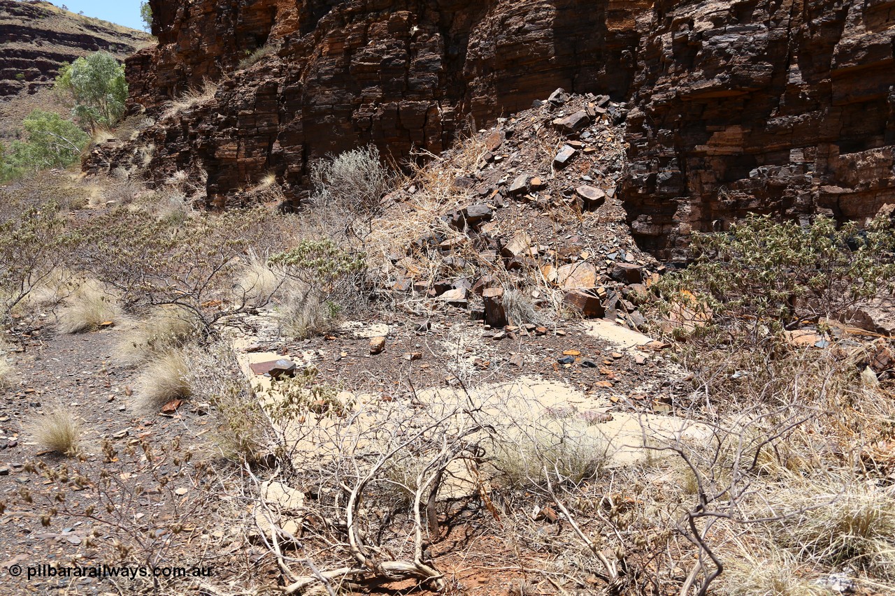 160101 9793
Wittenoom Gorge, Gorge Mine area, asbestos mining remains, concrete slab of former building located along the mine railway, adit 3 is behind the pile of rubble. [url=https://goo.gl/maps/46bmN7VJPj12]Geodata[/url].
