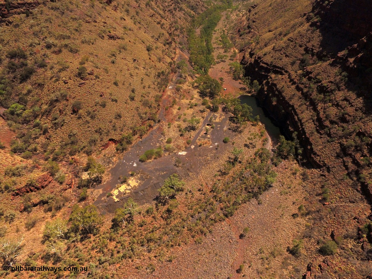 160101 DJI 0017
Wittenoom Gorge, view from above the Gorge Mine area and pool, looking north east, campers at pool, the drive can be seen cutting up the left side of the gorge, foot print of mine and building area clearly visible. [url=https://goo.gl/maps/tFzc7cw2fpB3MDRP9]Geodata[/url].
