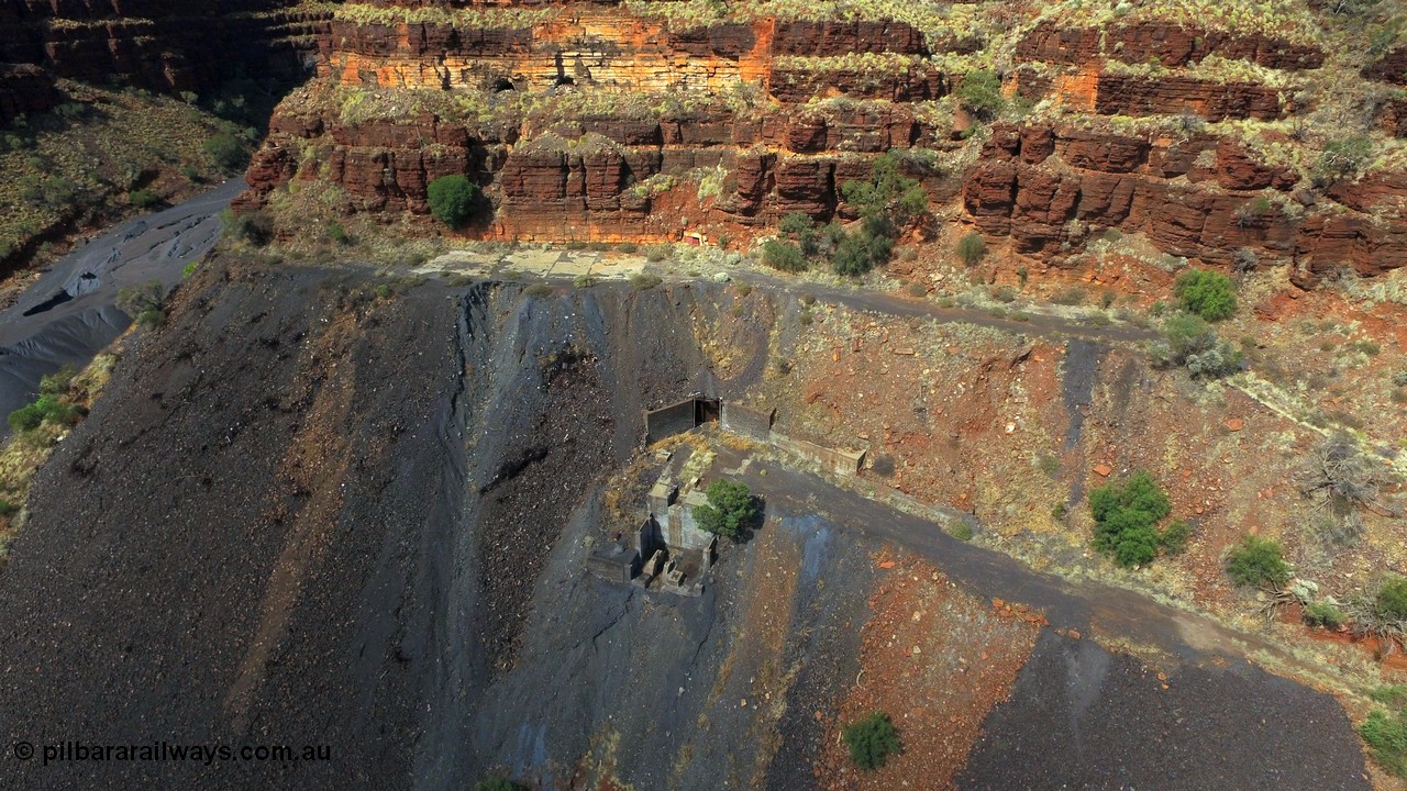 160103 DJI 0058
Colonial Mill and mine ruins located within Wittenoom Gorge. The large concrete area on the upper level is the former mining offices and railway workshops, a sharp eye will see the sealed mine entry with a red door. Concrete foundations remain of the once impressive crusher, mill, dryer and bagging plant. See images of the site intact [url=http://www.pilbararailways.com.au/gallery/thumbnails.php?album=117] here [/url], 194-08 shows the sealed red entry point. Geodata: [url=https://goo.gl/maps/BD1BiF3pHTr] -22.3112605 118.3190326 [/url].
