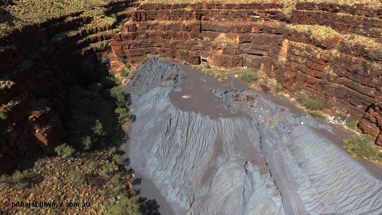 160103 DJI 0065
Colonial Mill and mine ruins located within Wittenoom Gorge. A number of mine adits or entry points are visible on this level along with the large amount of tailings, office structures and railway points and track visible. See images of the site intact [url=http://www.pilbararailways.com.au/gallery/thumbnails.php?album=117] here [/url], 194-08 shows the sealed red entry point. Geodata: [url=https://goo.gl/maps/xchrTph8qXttr3d26]-22.314205, 118.317905[/url].
