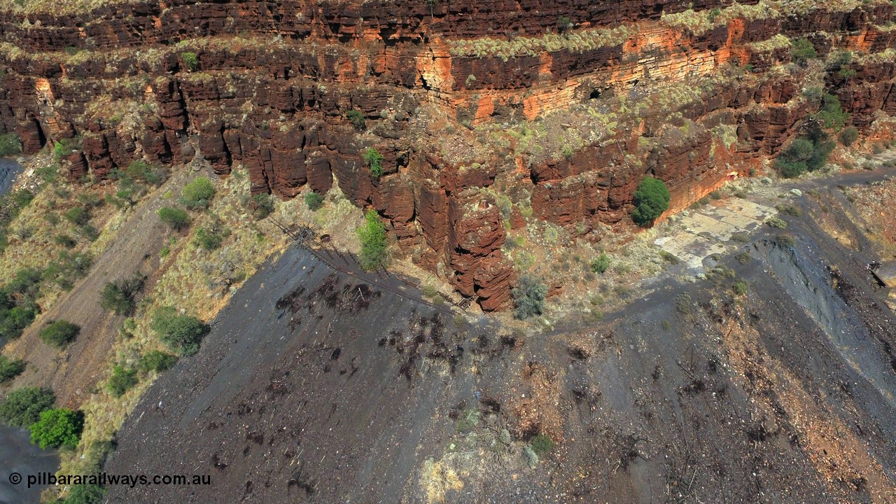 160103 DJI 0067
Colonial Mill and mine ruins located within Wittenoom Gorge. The large concrete area on the upper level is the former mining offices and railway workshops, a sharp eye will see the sealed mine entry with a red door. The tracks for the battery loco charging and maintenance area also stand out. See images of the site intact [url=http://www.pilbararailways.com.au/gallery/thumbnails.php?album=117] here [/url], 194-13 onwards shows the loco area. Geodata: [url=https://goo.gl/maps/sAcWhrFxDDPKBDxQ8]-22.312705, 118.319078[/url].

