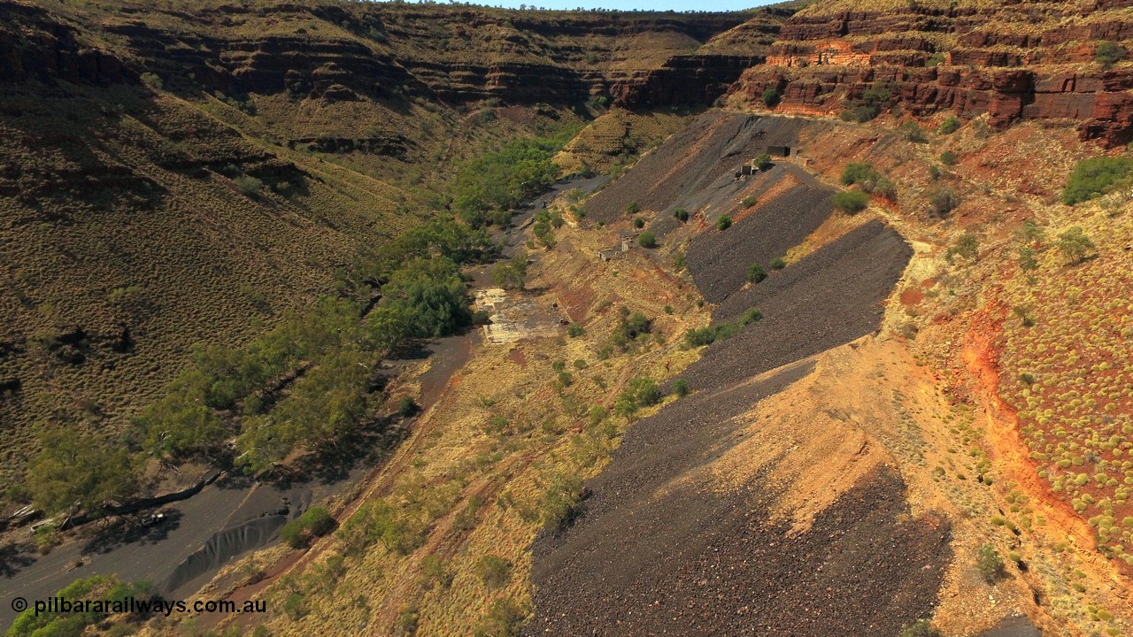 160103 DJI 0072
Colonial Mill and mine ruins located within Wittenoom Gorge. Concrete foundations remain of the once impressive crusher, mill, dryer and bagging plant. See images of the site intact [url=http://www.pilbararailways.com.au/gallery/thumbnails.php?album=118] here [/url]. Geodata: [url=https://goo.gl/maps/D9EB6GYh97z] -22.3090405 118.3190116 [/url].
