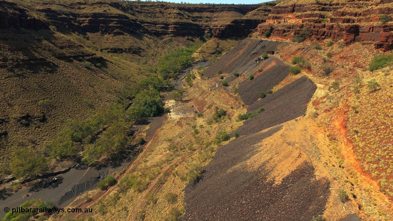 160103 DJI 0073
Colonial Mill and mine ruins located within Wittenoom Gorge. Concrete foundations remain of the once impressive crusher, mill, dryer and bagging plant. See images of the site intact [url=http://www.pilbararailways.com.au/gallery/thumbnails.php?album=118] here [/url]. Geodata: [url=https://goo.gl/maps/D9EB6GYh97z] -22.3090405 118.3190116 [/url].
