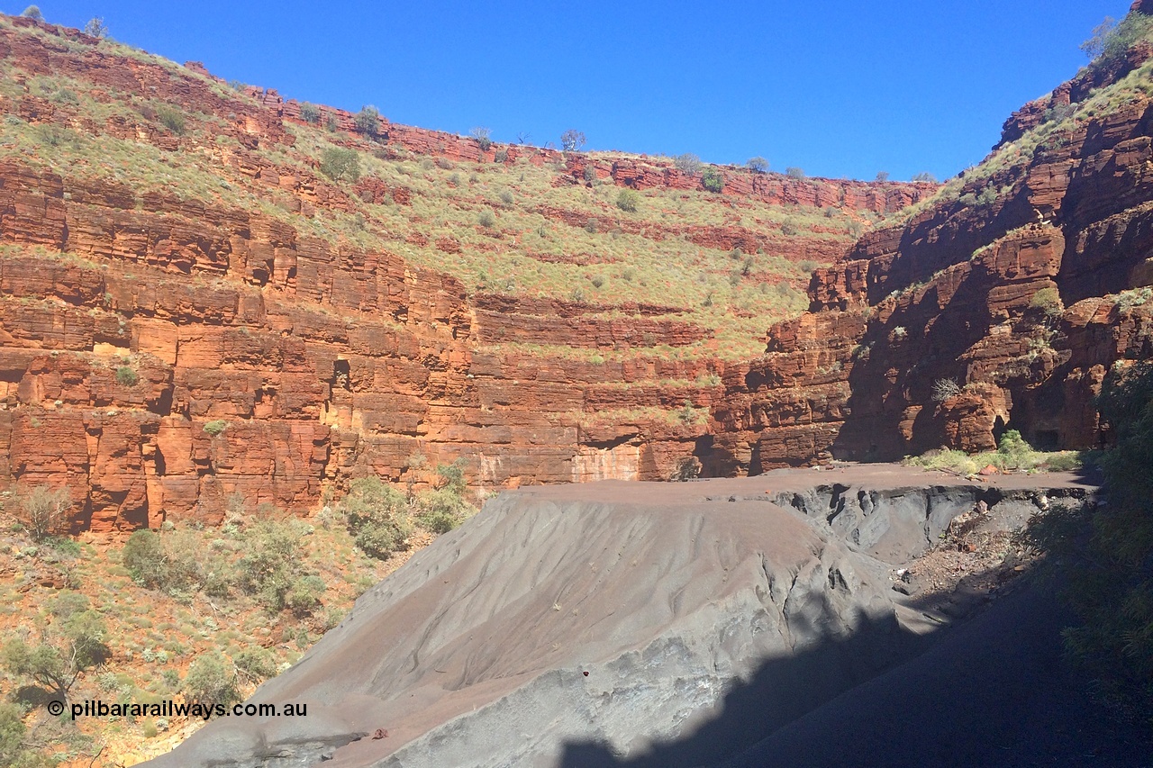 160710 iPh5S 2795
Wittenoom Gorge, Colonial Mine, looking in a west / south west direction across the upper level on the tailings to adits 27 and 28 from the old building frame.
