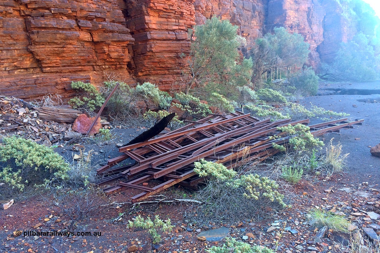 160710 iPh5S 2798
Wittenoom Gorge, Colonial Mine, reverse view of 2797 looking north east back over the underground railway points on the upper level with the old building frame in the background.
