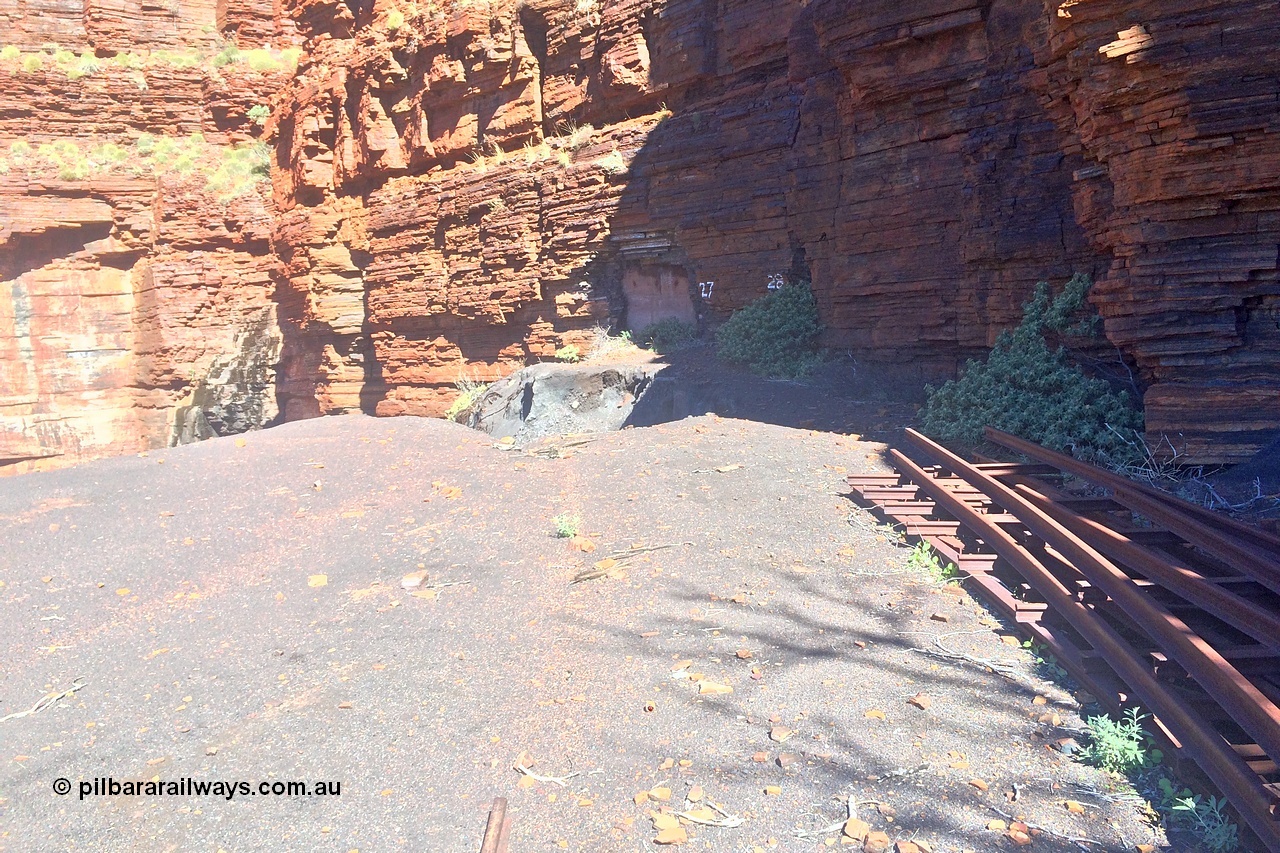 160710 iPh5S 2802
Wittenoom Gorge, Colonial Mine, view looking across the level to adits #28 and #27. Tailings fill has eroded, old track points or switches stacked up. [url=https://goo.gl/maps/maDEBws4ULiH7nWz6]Geodata[/url].
