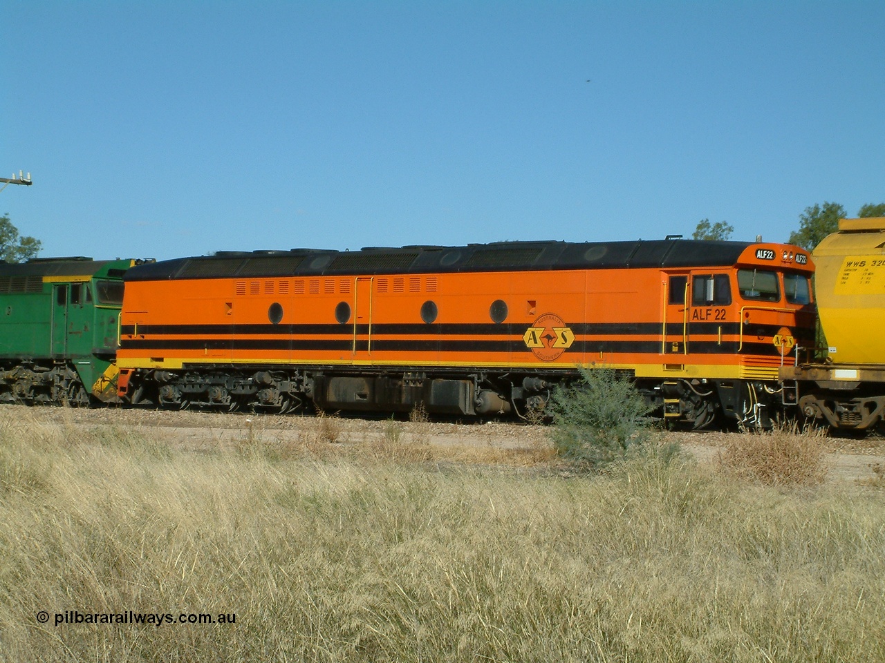 030403 153802
Gladstone, MKA (Morrison Knudsen Australia) rebuilt AL class AL 23 into EMD JT26C-2M model for Australian National in 1993 as the ALF class, here ALF 22 serial 94-AB-022 is second unit on a gradin train being loaded on the 3rd April 2003.
Keywords: ALF-class;ALF22;MKA;EMD;JT26C-2M;94-AN-022;rebuild;AL-class;AL23;Clyde-Engineering;EMD;JT26C;76-839;