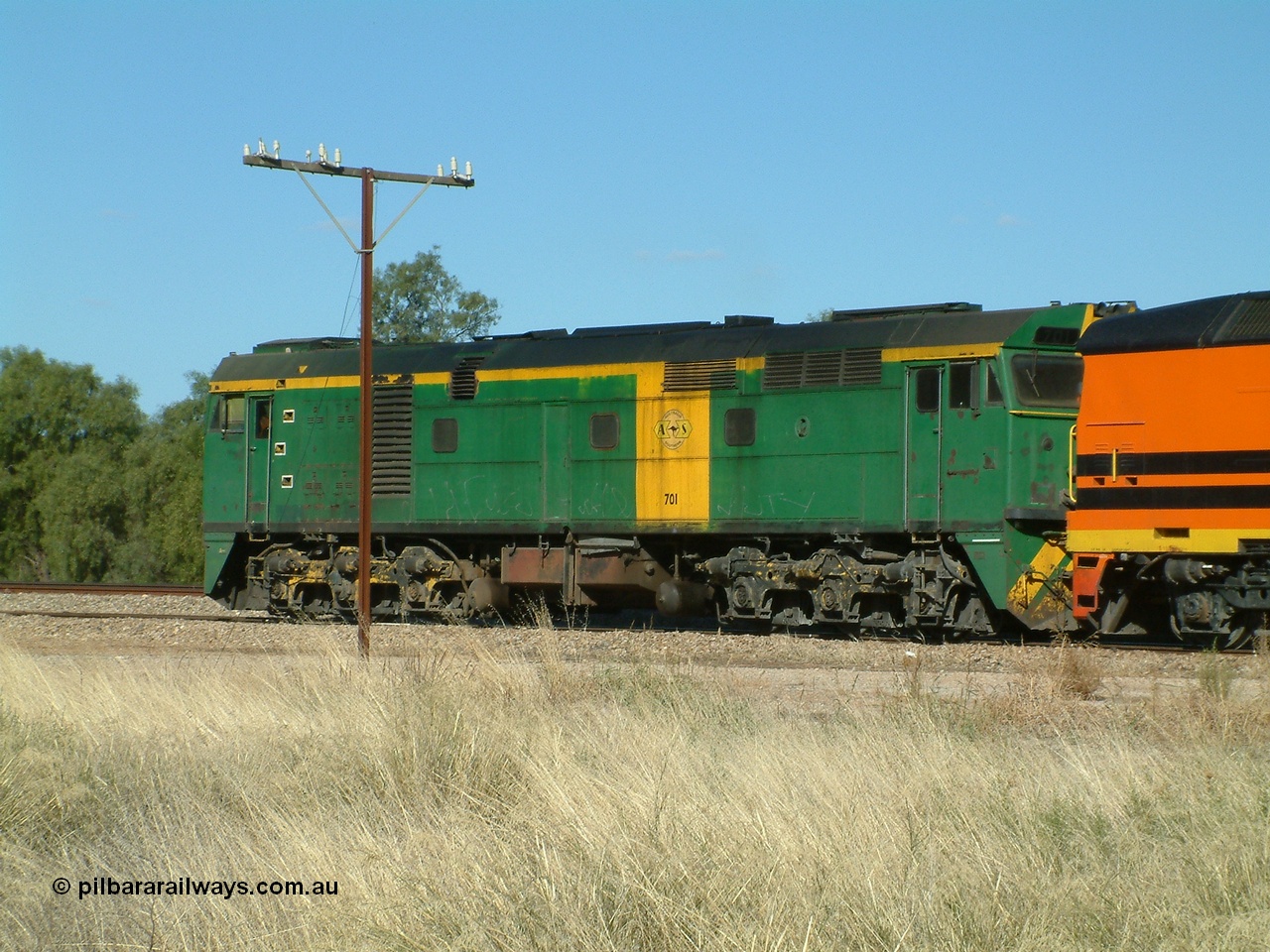 030403 153816
Gladstone, former South Australian Railways AE Goodwin built DL500G ALCo designated the 700 class, class leader 701 serial G6042-2 leads a grain train being loaded on the 3rd April 2003.
Keywords: 700-class;701;AE-Goodwin;ALCo;DL500G;G6042-2;