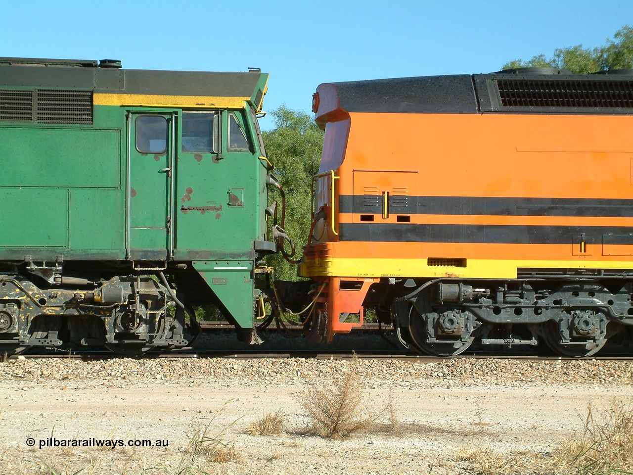 030403 154207
Gladstone, MKA (Morrison Knudsen Australia) rebuilt AL class AL 23 into EMD JT26C-2M model for Australian National in 1993 as the ALF class, here ALF 22 serial 94-AB-022 shows the blanked off No.2 end cab as it is coupled to an A E Goodwin built ALCo 700 class on the 3rd April 2003.
Keywords: ALF-class;ALF22;MKA;EMD;JT26C-2M;94-AN-022;rebuild;AL-class;AL23;Clyde-Engineering;EMD;JT26C;76-839;
