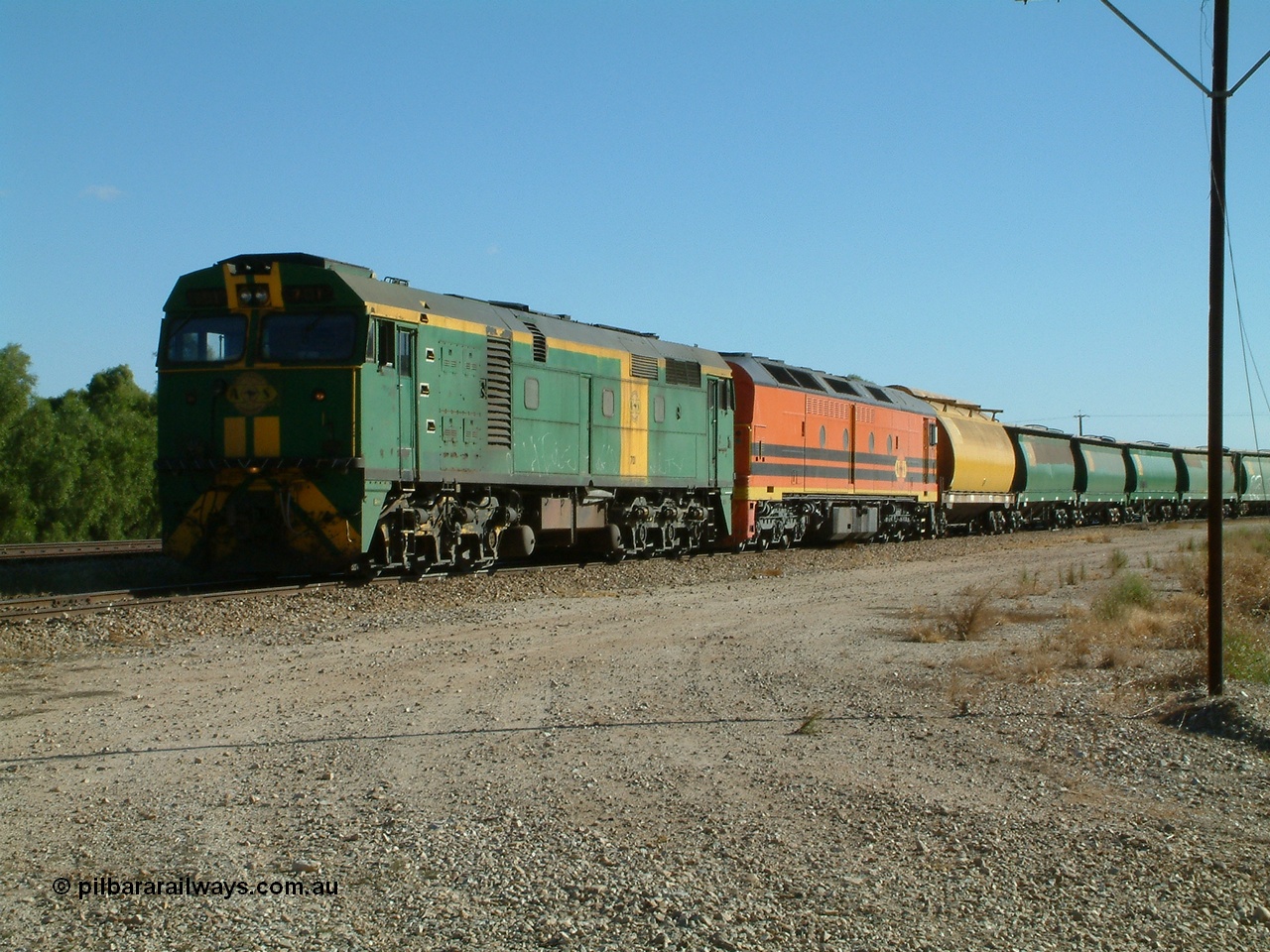 030403 154420
Gladstone, former South Australian Railways AE Goodwin built DL500G ALCo designated the 700 class, class leader 701 serial G6042-2 leads a grain train with an ALF class and first waggon a former WAGR WW now WWS grain waggon, train being loaded on the 3rd April 2003.
Keywords: 700-class;701;AE-Goodwin;ALCo;DL500G;G6042-2;
