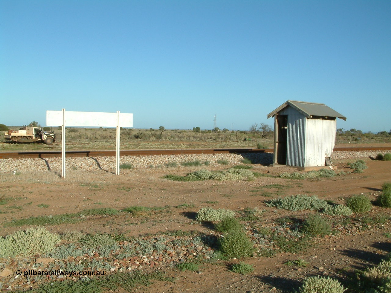 030404 074333
Port Germein, looking from the east side of station with name board and shelter, ute with camp on far side. 4th April 2003.
