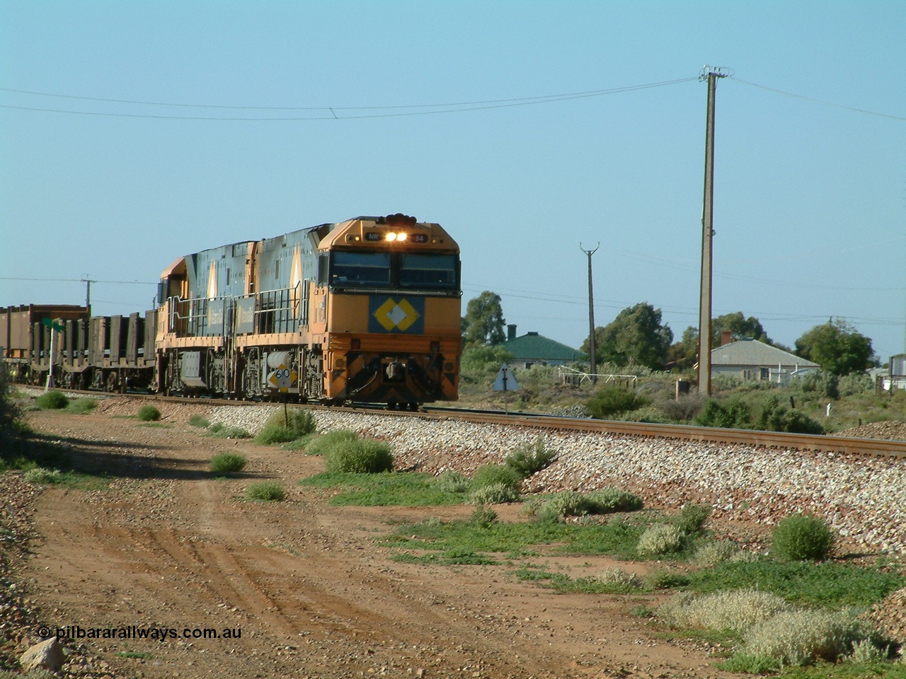 030404 082806
Port Germein, Perth bound steel and intermodal hurries through on the main behind National Rail's Goninan built GE Cv40-9i model NR class units NR 30 serial 7250-06 / 97-236 and a sister unit. 4th April 2003.
Keywords: NR-class;NR34;Goninan;GE;Cv40-9i;7250-06/97-236;