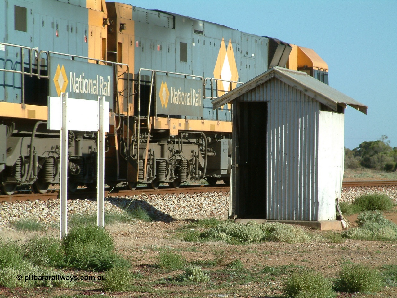 030404 082817
Port Germein, Perth bound steel and intermodal hurries through on the main behind National Rail's Goninan built GE Cv40-9i model NR class units NR 30 serial 7250-06 / 97-236 and a sister unit. 4th April 2003.
