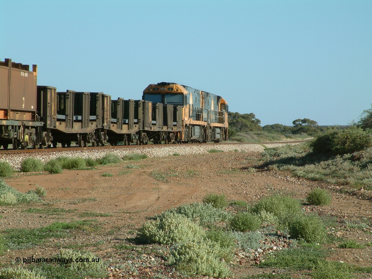 030404 082825
Port Germein, Perth bound steel and intermodal hurries through on the main behind National Rail's Goninan built GE Cv40-9i model NR class units NR 30 serial 7250-06 / 97-236 and a sister unit. 4th April 2003.
