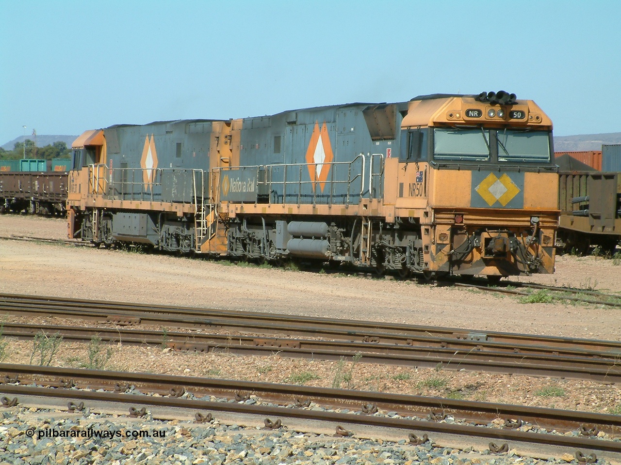 030404 103651
Port Augusta Spencer Junction yard, National Rail Goninan built GE Cv40-9i model NR class unit NR 50 serial 7250-08 / 97-252 lay about the yard in between jobs. 4th April 2003.
Keywords: NR-class;NR50;Goninan;GE;Cv40-9i;7250-08/97-252;