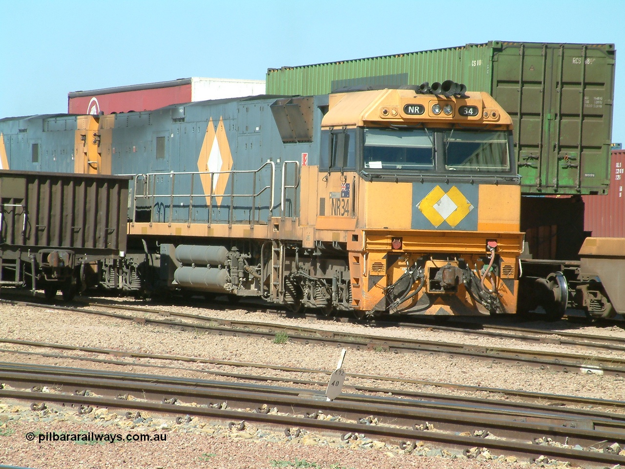 030404 104006
Port Augusta Spencer Junction yard, National Rail Goninan built GE Cv40-9i model NR class unit NR 34 serial 7250-06 / 97-236 sits in the yard in between jobs. 4th April 2003.
Keywords: NR-class;NR34;Goninan;GE;Cv40-9i;7250-06/97-236;