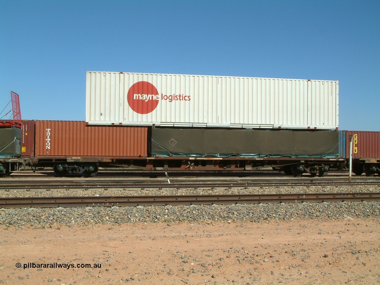 030404 104048
Port Augusta Spencer Junction yard, RQKY type 60' container flat waggon fitted with aligned bogies RQKY 2690 was originally built by Perry Engineering SA in 1974 in a batch of forty five RM type container waggon, fitted with aligned bogies and recoded to AQPY type. Seen here with a Mayne Logistics 48' DRC 382 container on top of a 40' half height tarped load. 4th April 2003.
Keywords: RQKY-type;RQKY2690;Perry-Engineering-SA;RM-type;AQPY-type;AQMP-type;