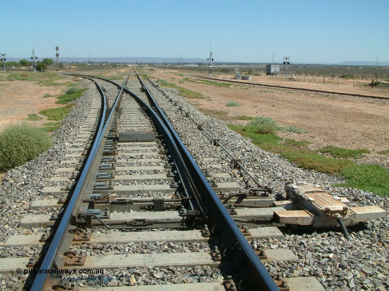 030404 120343
Stirling North, looking west to Port Augusta, line to Port Augusta power station is diverging left, the narrow gauge line for Pichi Richi Railway is on the far right.
