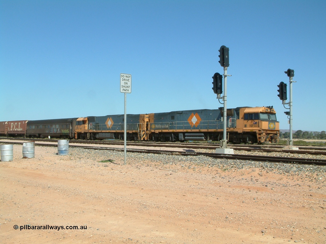 030404 125029
Port Augusta Spencer Junction yard, a Perth bound intermodal awaits departure time on 13 Road behind National Rail NR class units built by Goninan as GE Cv40-9i models, NR 50 serial 7250-08 / 97-252 and NR 37 serial 7250-06 / 97-239. 4th April 2003.
Keywords: NR-class;NR50;Goninan;GE;Cv40-9i;7250-08/97-252;