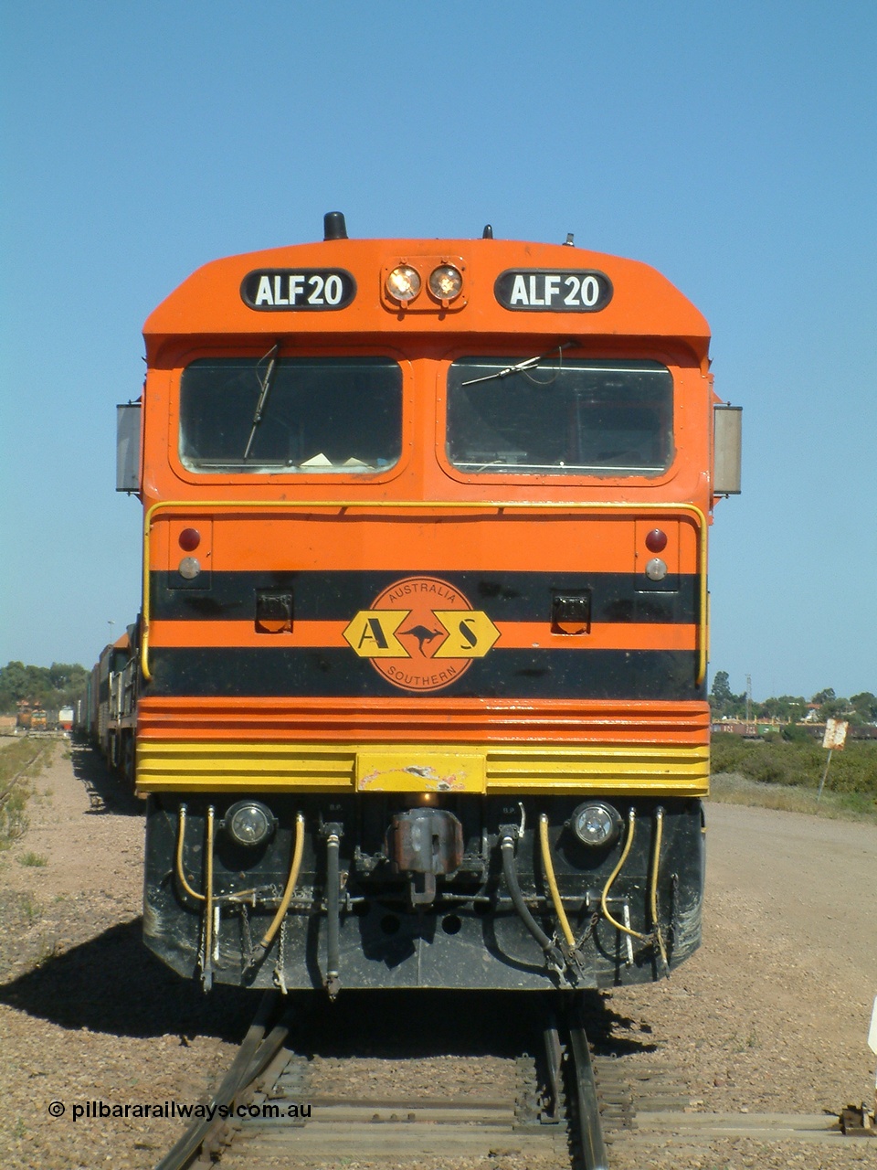 030404 141132
Port Augusta Spencer Junction yard, MKA (Morrison Knudsen Australia) rebuilt AL class AL 24 into EMD JT26C-2M model for Australian National in 1993 as the ALF class, here ALF 20 serial 94-AB-020 shunts empty rail transport waggon sets from the Darwin construction. 4th April, 2003.
Keywords: ALF-class;ALF20;MKA;EMD;JT26C-2M;94-AN-020;rebuild;AL-class;AL24;Clyde-Engineering;EMD;JT26C;76-840;