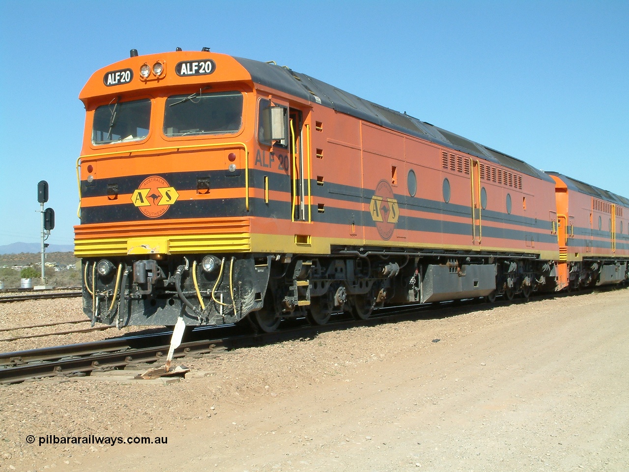 030404 141224
Port Augusta Spencer Junction yard, MKA (Morrison Knudsen Australia) rebuilt AL class AL 24 into EMD JT26C-2M model for Australian National in 1993 as the ALF class, here ALF 20 serial 94-AB-020 shunts empty rail transport waggon sets from the Darwin construction. 4th April, 2003.
Keywords: ALF-class;ALF20;MKA;EMD;JT26C-2M;94-AN-020;rebuild;AL-class;AL24;Clyde-Engineering;EMD;JT26C;76-840;
