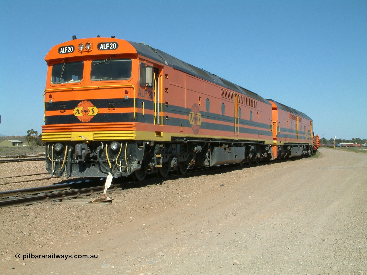 030404 141457
Port Augusta Spencer Junction yard, MKA (Morrison Knudsen Australia) rebuilt AL class AL 24 into EMD JT26C-2M model for Australian National in 1993 as the ALF class, here ALF 20 serial 94-AB-020 shunts empty rail transport waggon sets from the Darwin construction. 4th April, 2003.
Keywords: ALF-class;ALF20;MKA;EMD;JT26C-2M;94-AN-020;rebuild;AL-class;AL24;Clyde-Engineering;EMD;JT26C;76-840;