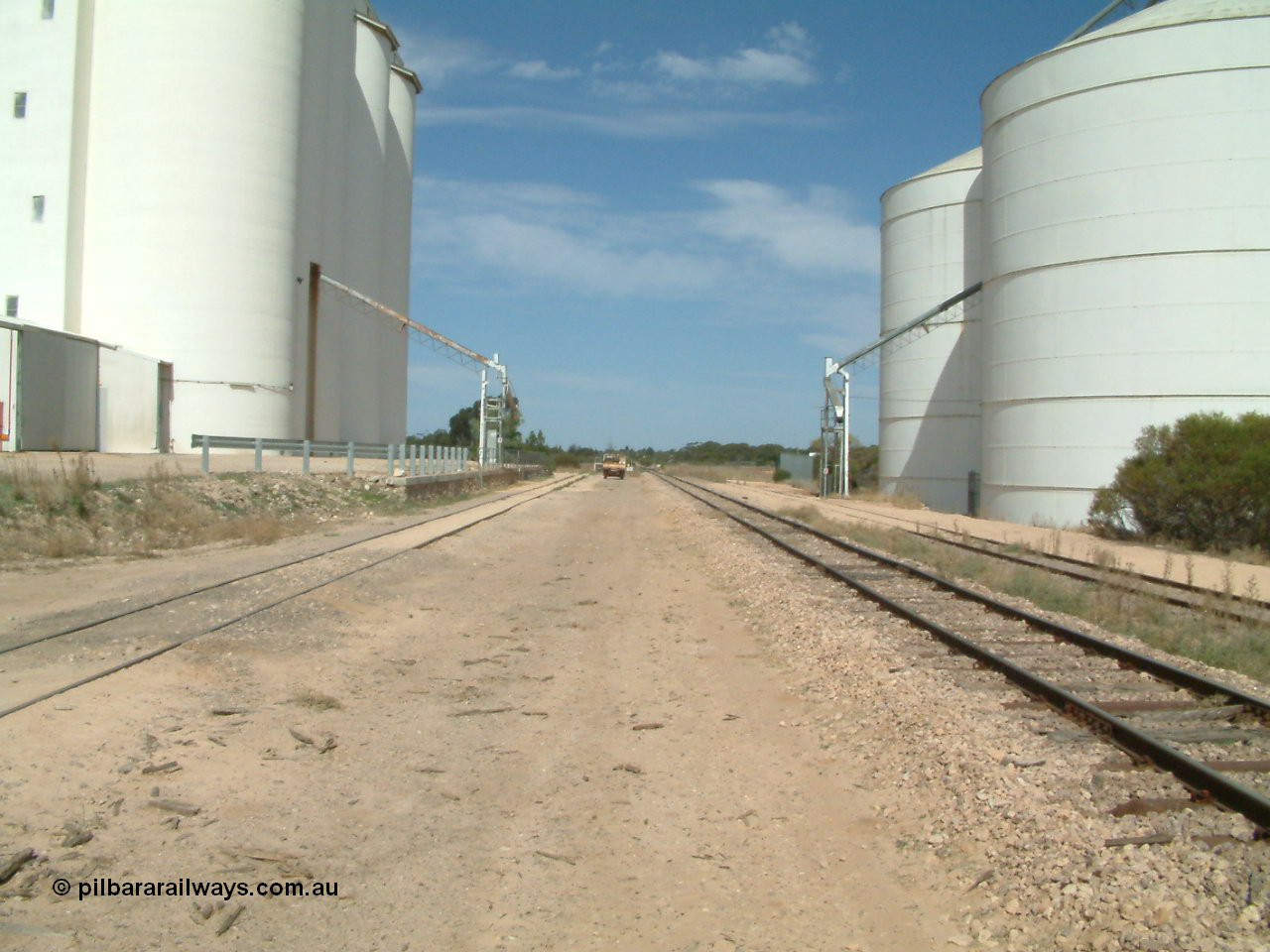 030405 140326
Kyancutta, yard view looking south with both silo complexes and their respective sidings either side of the mainline, looking south, 5th April 2003.
