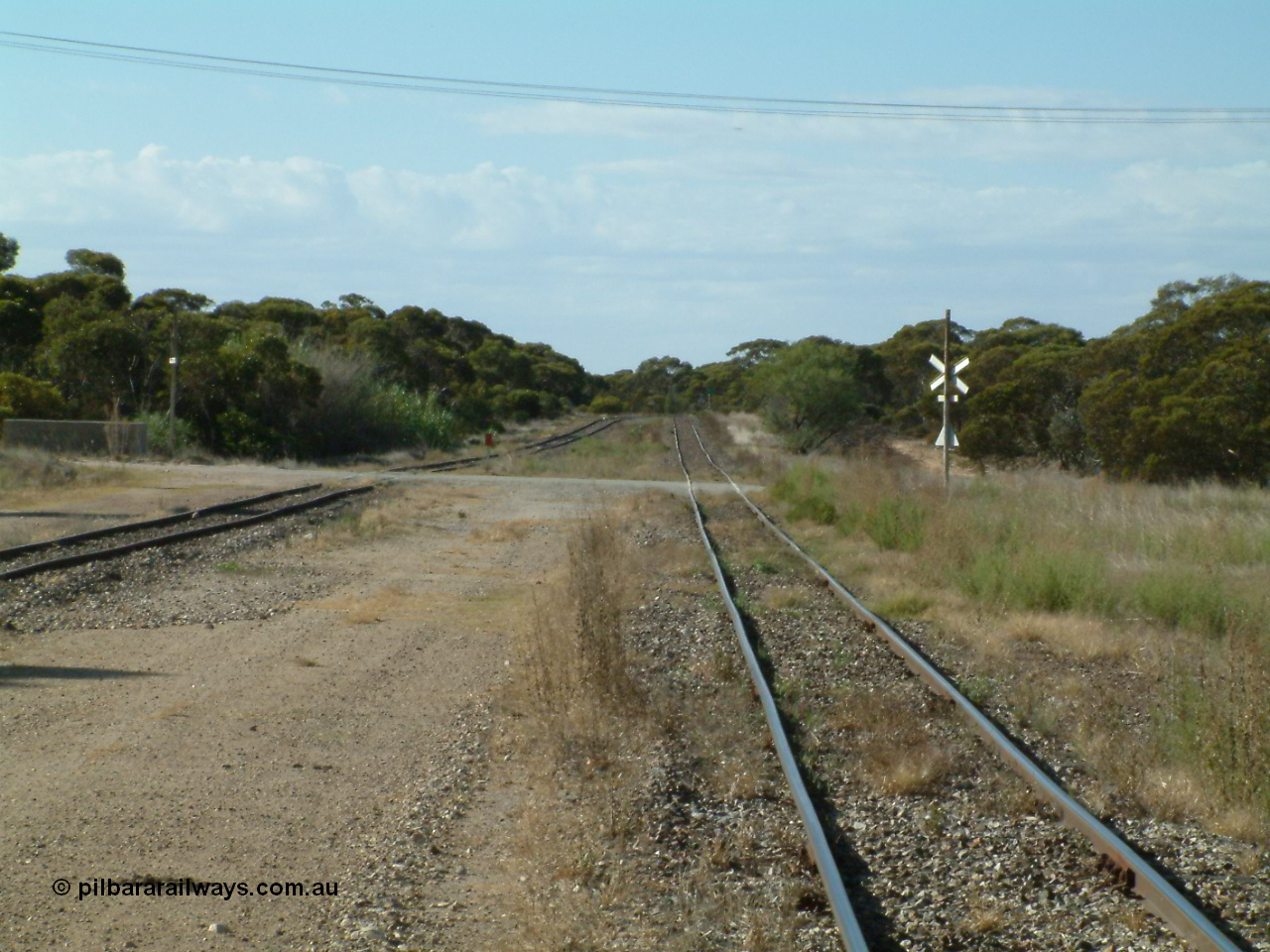 030405 155314
Lock, yard view looking north across the grade crossing for Pilkagee Rd, 5th April 2003.
