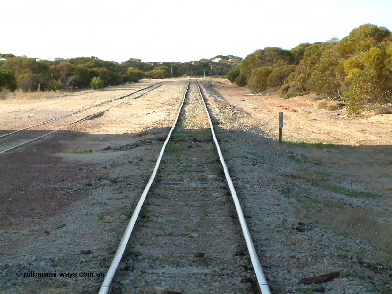 030406 082620
Murdinga, station located at the 128.2 km, originally opened December 1935 and originally referred to as Corunna, front elevation view of train control cabin and waiting room - shelter with station name board, 6th April 2003.
