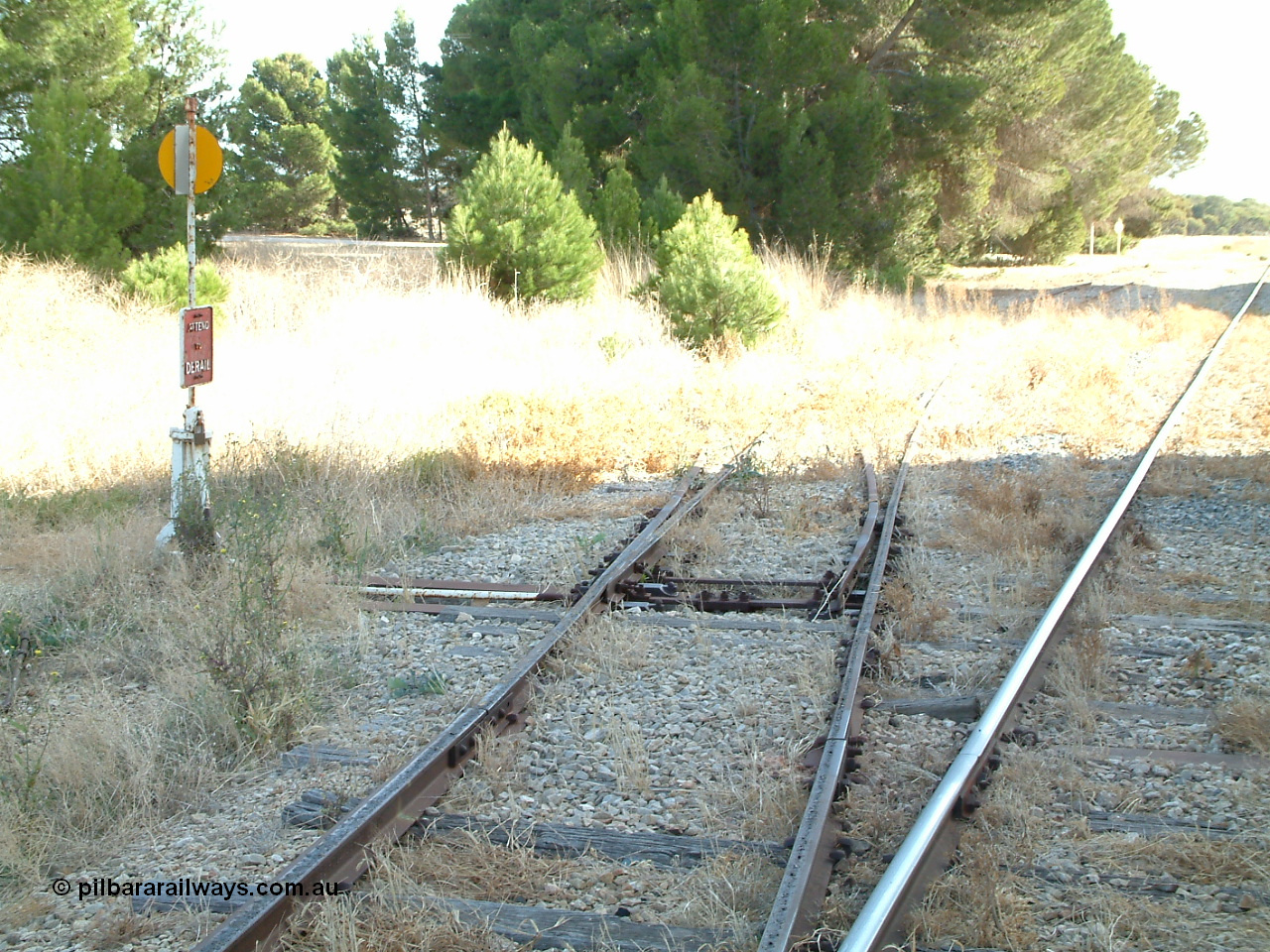 030406 092406
Yeelanna, yard view of the station siding looking north with the points, lever and indicator for the south leg of the triangle and line curving away to the left visible. 6th April 2003.
