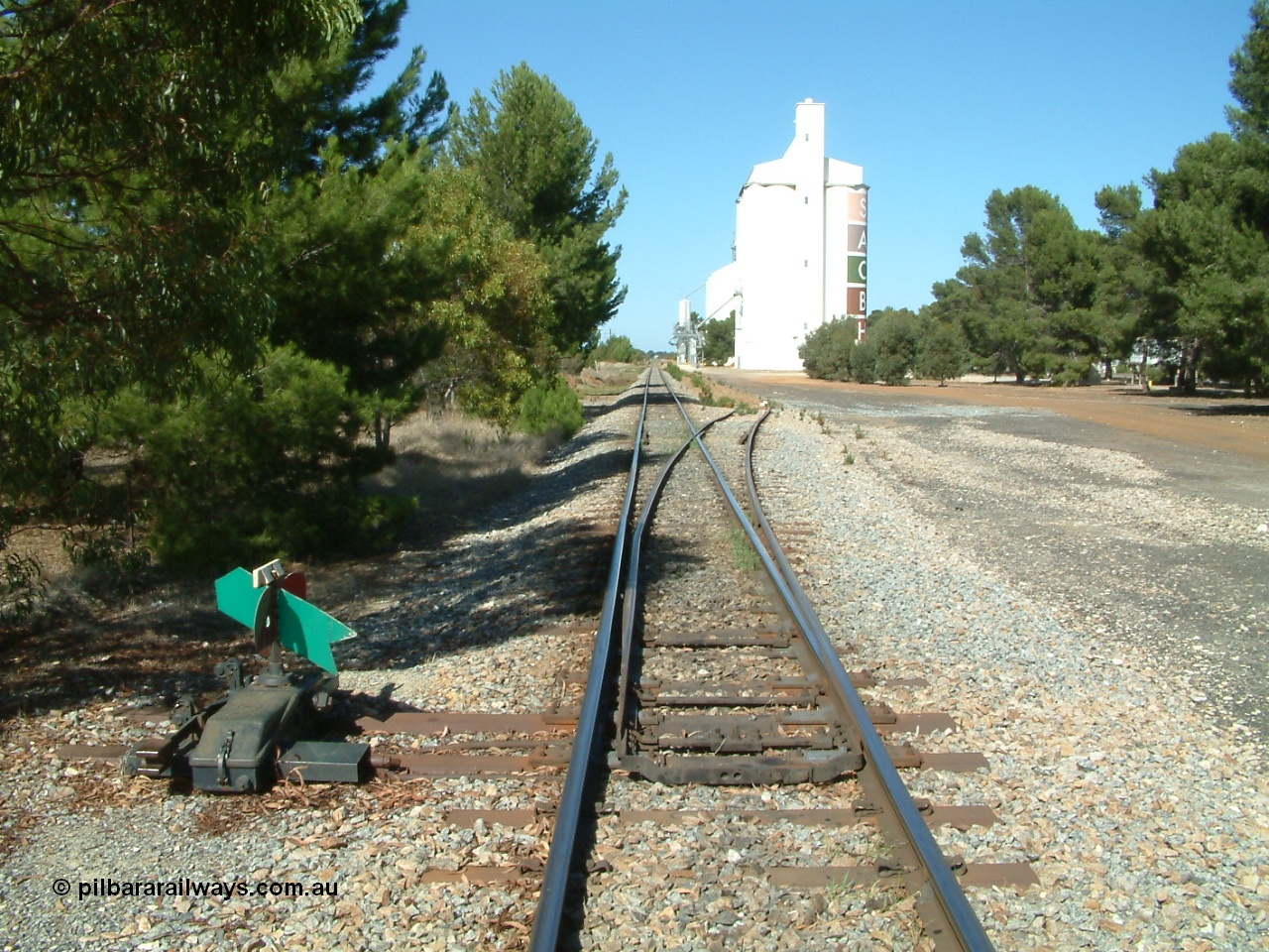 030406 102814
Edillilie, station located at the 51.3 km, opened in November 1907 as Mortlock, renamed in October 1908. Yard overview looking south with silo complexes on the right. 6th April 2003.

