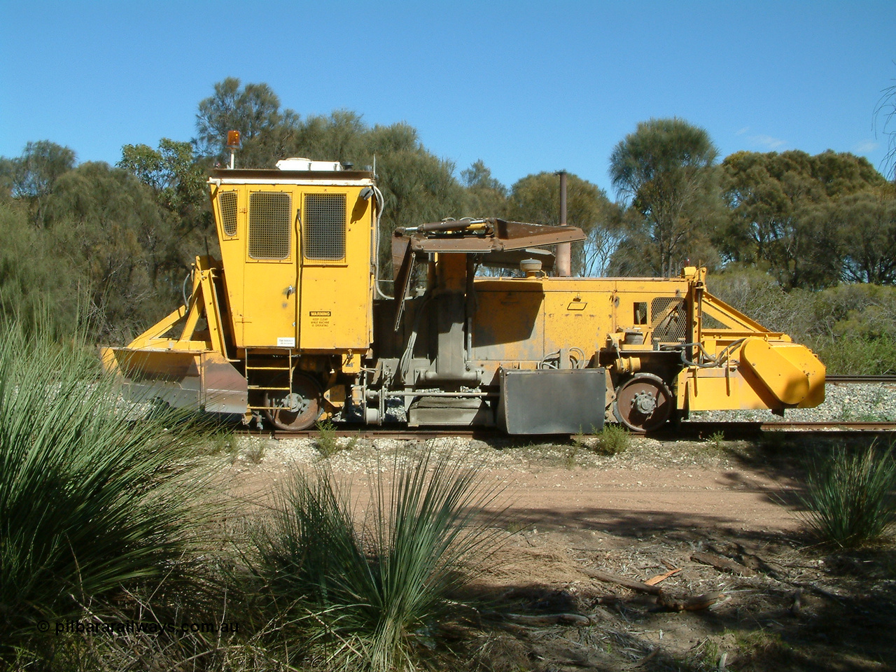 030406 110810
Coomunga, stabled on the siding, Transfield track machine ballast regulator. 6th April 2003.
Keywords: track-machine;