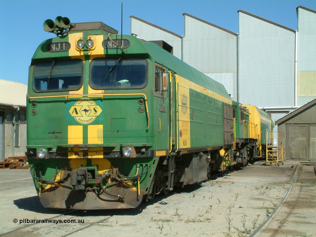 030406 114350
Port Lincoln loco workshops, still wearing the former owner's AN livery, Australian Southern locomotive and NJ class leader NJ 1 'Ben Chifley' Clyde Engineering EMD model JL22C serial 71-728, in multiple unit consist, roster shot. 6th April 2003.
Keywords: NJ-class;NJ1;Clyde-Engineering-Granville-NSW;EMD;JL22C;71-728;