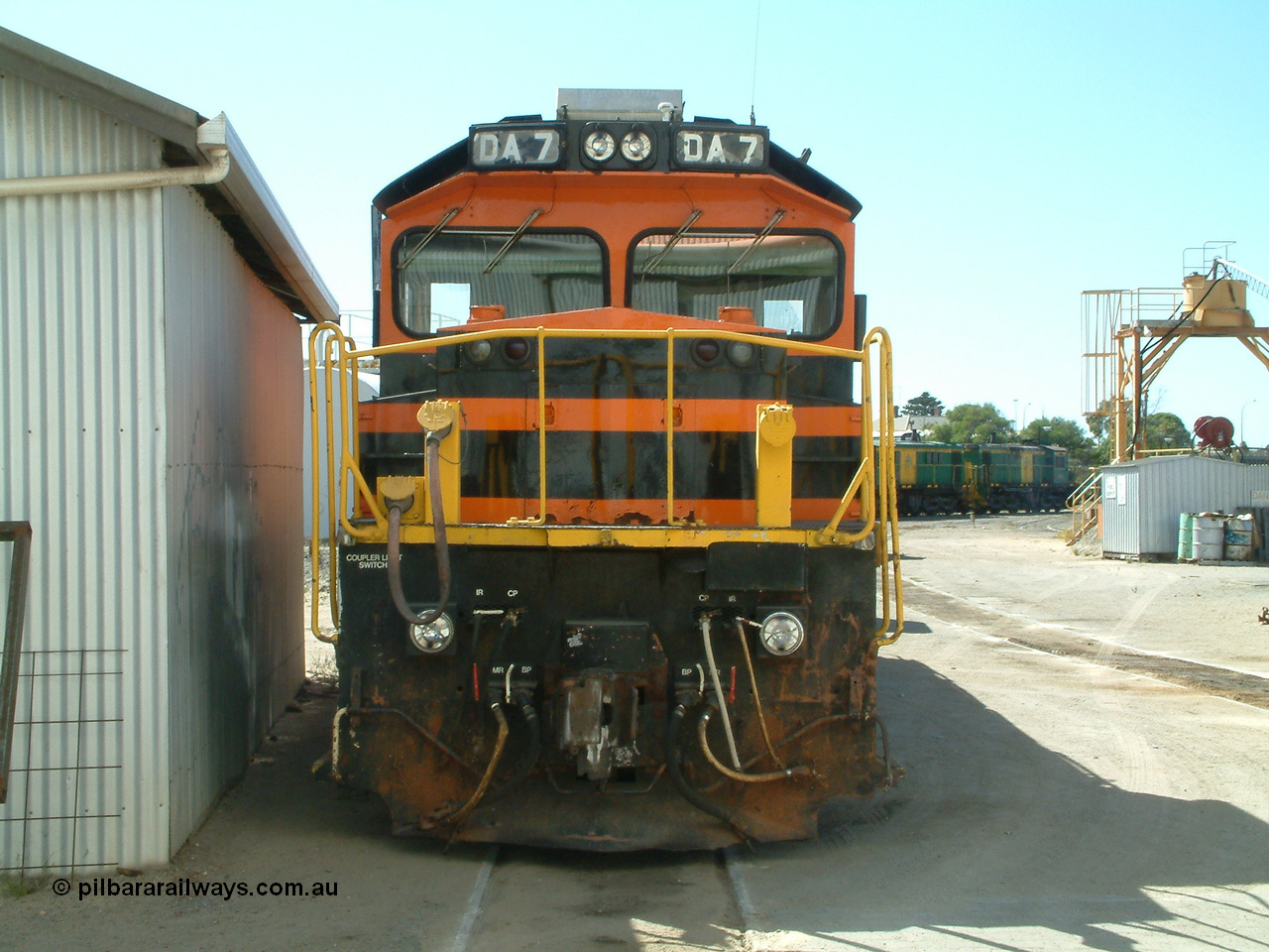 030406 114700
Port Lincoln loco workshops, wearing Australian Southern livery rebuild ALCo locomotive unit DA 7 started life as NSWGR 48 class 4813 AE Goodwin ALCo model DL531 serial 83713, rebuilt by Islington Workshops with long hood and parts from former 830 class 870 AE Goodwin ALCo model DL531 serial G6016-06 in 1998. Cab front view. 6th April 2003.
Keywords: DA-class;DA7;83713;Port-Augusta-WS;ALCo;DL531G/1;48-class;4813;rebuild;