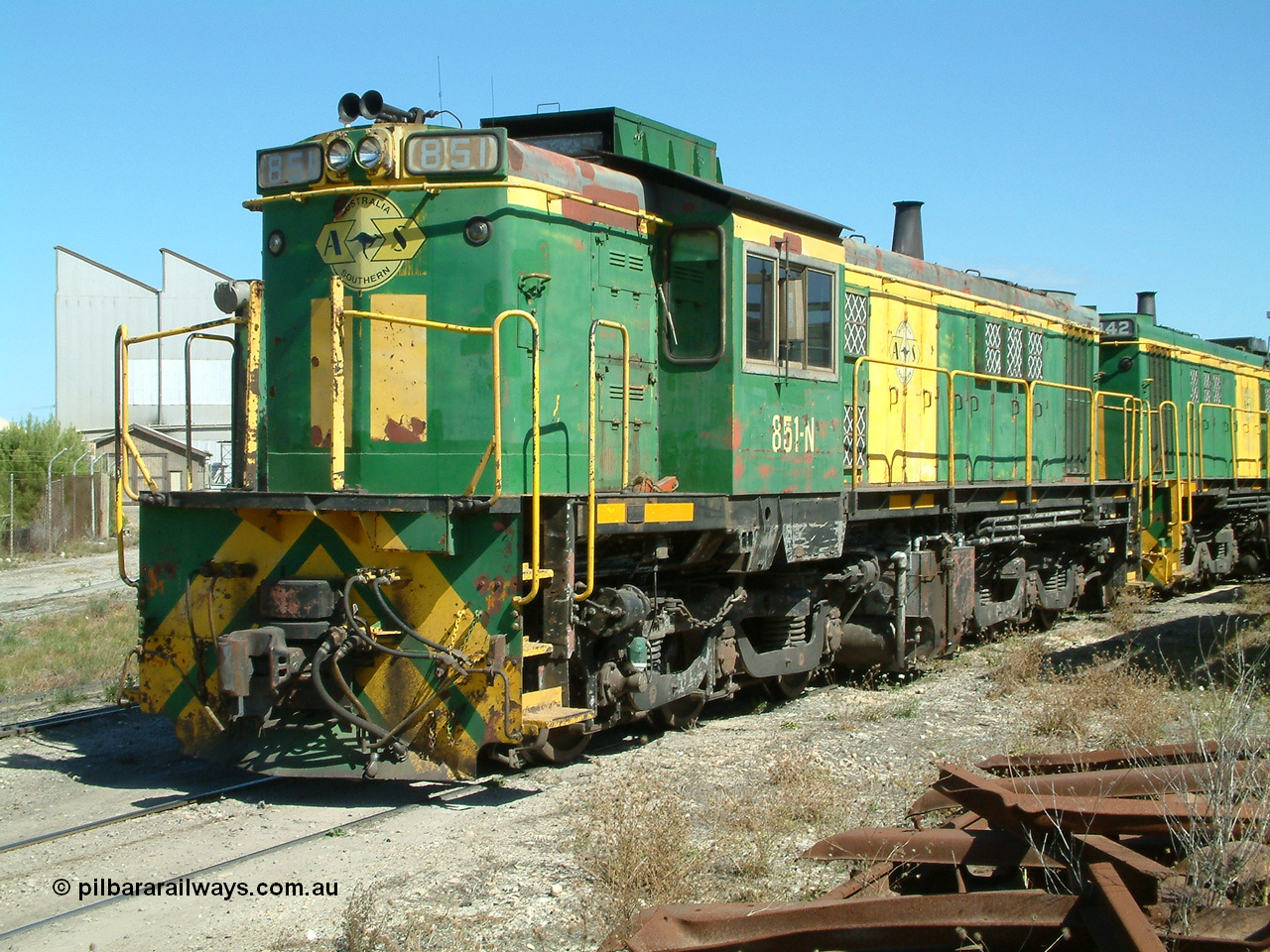 030406 115400
Port Lincoln loco workshops, still in former owner AN livery, Australian Southern 830 class locomotive 851 AE Goodwin ALCo model DL531 serial 84137 which has been on the Eyre Peninsula Division since being built in April 1962, roster shot coupled to sister unit. 6th April 2003.
Keywords: 830-class;851;AE-Goodwin;ALCo;DL531;84137;