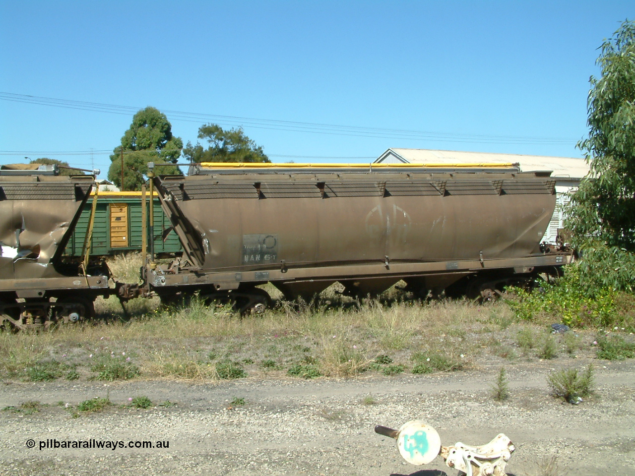 030406 115540
Port Lincoln, derailment damaged SAR Islington Workshops built HAN type bogie wheat waggon, HAN 6, stored at the workshops yards. 6th April 2003.
Keywords: HAN-type;HAN6;1969-73/68-6;SAR-Islington-WS;