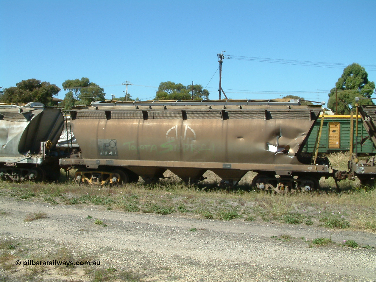 030406 115544
Port Lincoln, derailment damaged SAR Islington Workshops built HAN type bogie wheat waggon HAN 4, stored at the workshops yards. 6th April 2003.
Keywords: HAN-type;HAN4;1969-73/68-4;SAR-Islington-WS;