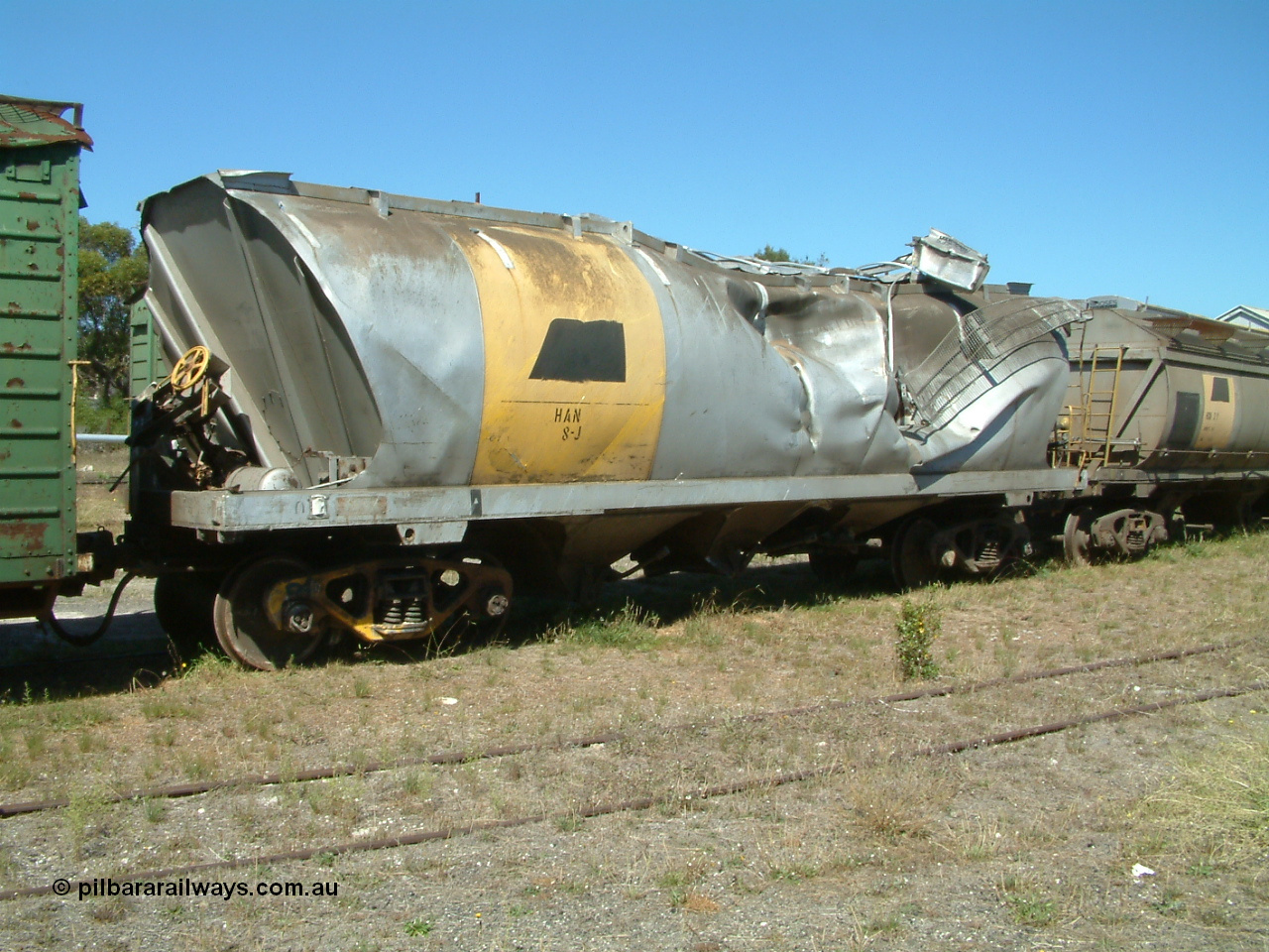 030406 115732
Port Lincoln, derailment damaged SAR Islington Workshops built HAN type bogie wheat waggon HAN 8, stored at the workshops yards. 6th April 2003.
Keywords: HAN-type;HAN8;1969-73/68-8;SAR-Islington-WS;